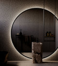 Round wall mirror in a bathroom
